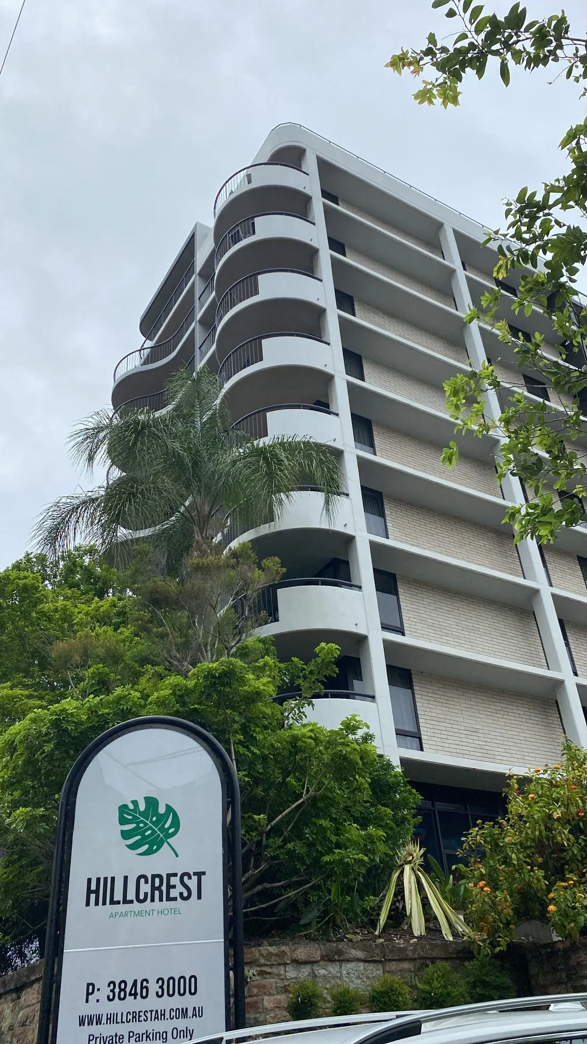 Multi-storey curved-balcony Hillcrest Apartment Hotel tower
