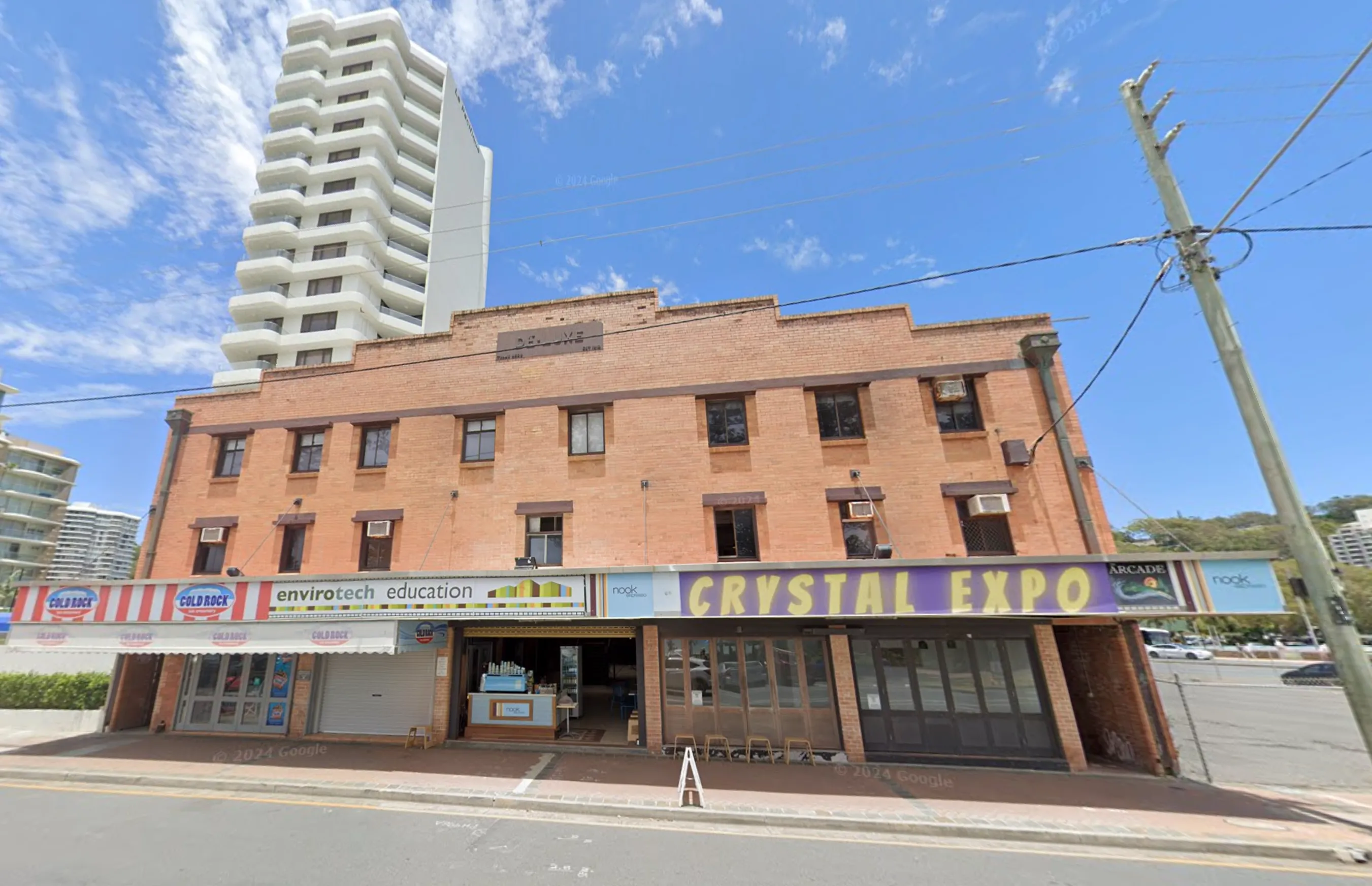 Multi-storey brick building with Crystal Expo and Envirotech Education tenants
