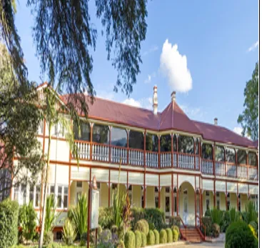 Historic two-storey Glennie School main building with verandahs