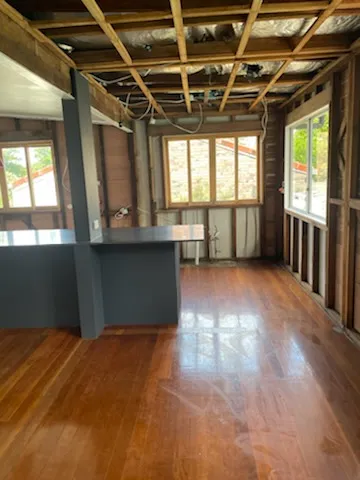 Interior stripped back to timber frame after asbestos lining removal