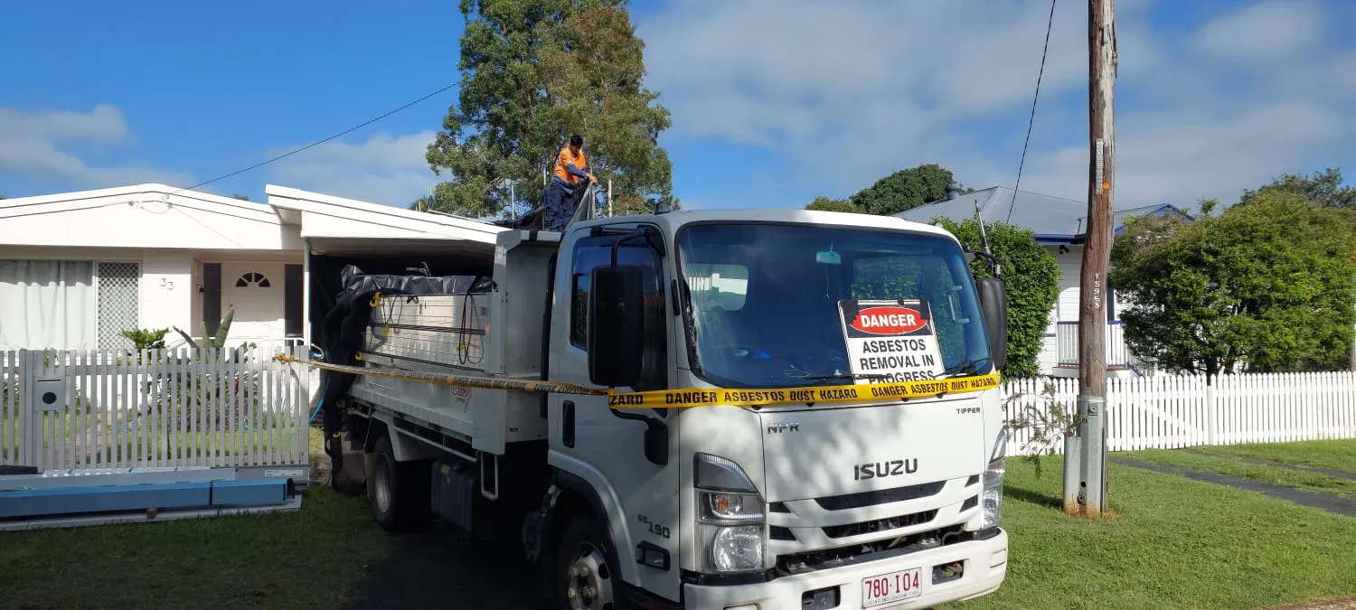 Asbestos Watch removal truck on-site, asbestos removal in progress