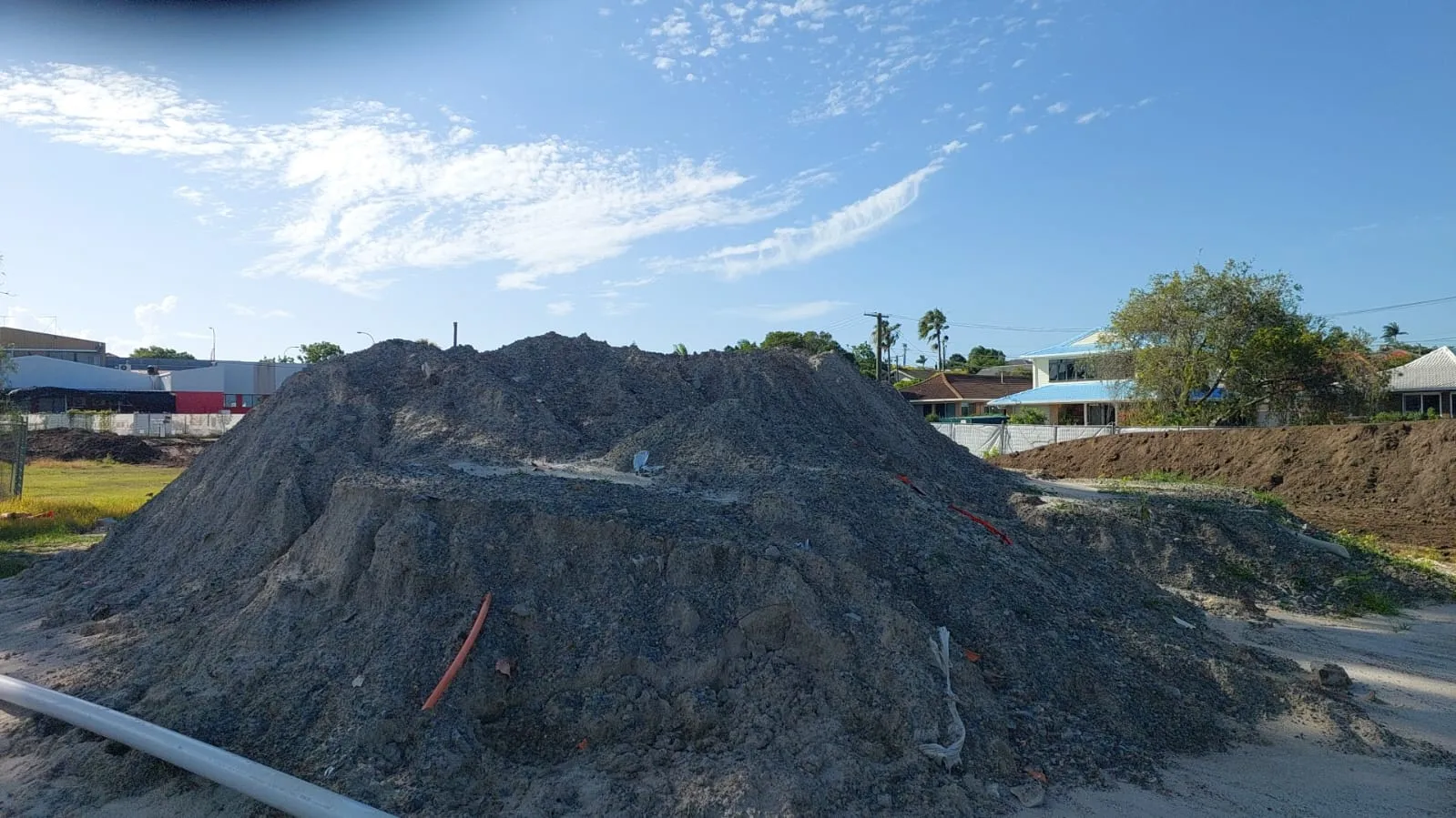 Stockpiled contaminated soil staged for lawful disposal