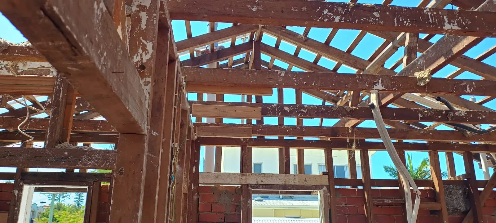 Roof stripped back to open timber trusses