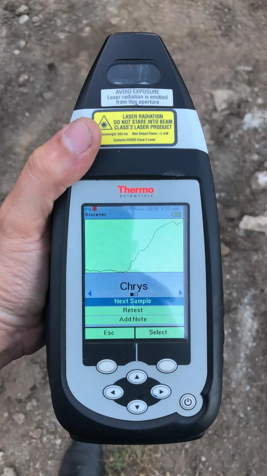 Handheld XRF analyser showing a chrysotile asbestos result on-site